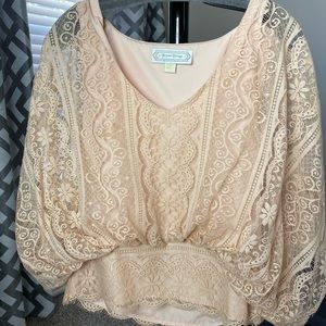 Nude/pink lace top with flared sleeves